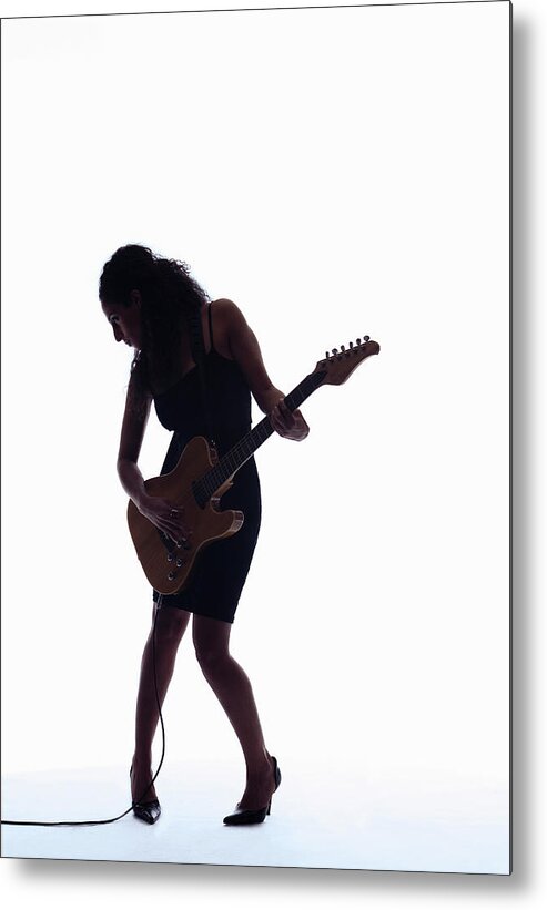 Expertise Metal Print featuring the photograph Silhouette Of Woman Playing Guitar by Pm Images