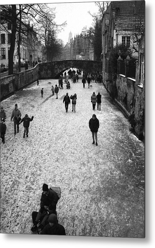 Frozen-canals Metal Print featuring the photograph Walking On Ice In Bruges by Yvette Depaepe