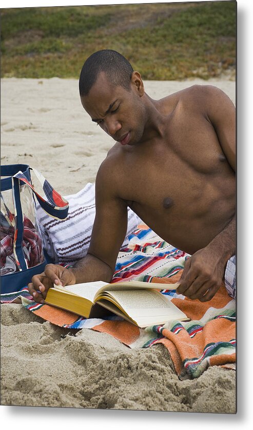 People Metal Print featuring the photograph African man reading book on beach by Sam Bloomberg-Rissman