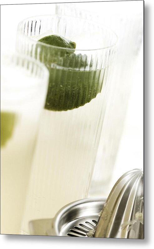 Alcohol Metal Print featuring the photograph Cocktails with lime, close-up. by Luk Thys