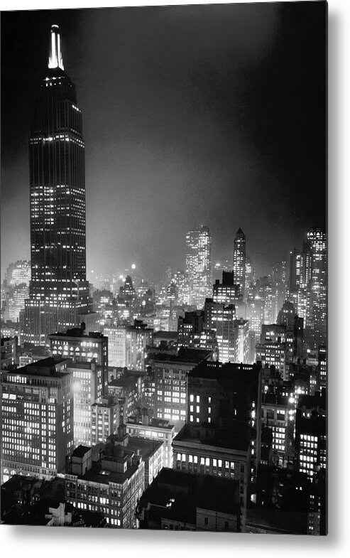 Empire State Building Metal Print featuring the photograph NYC At Night - Empire State Building - Circa 1937 by War Is Hell Store