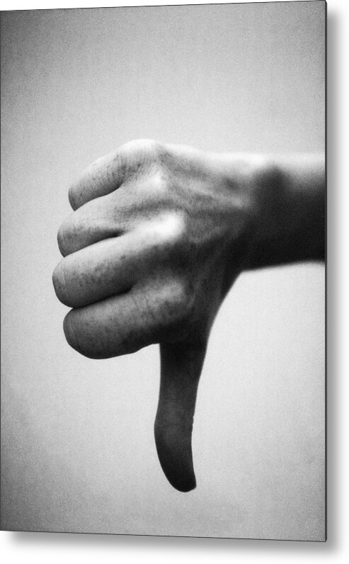 Thumb Metal Print featuring the photograph Thumb pointing down, close-up, b&w by Laurent Hamels