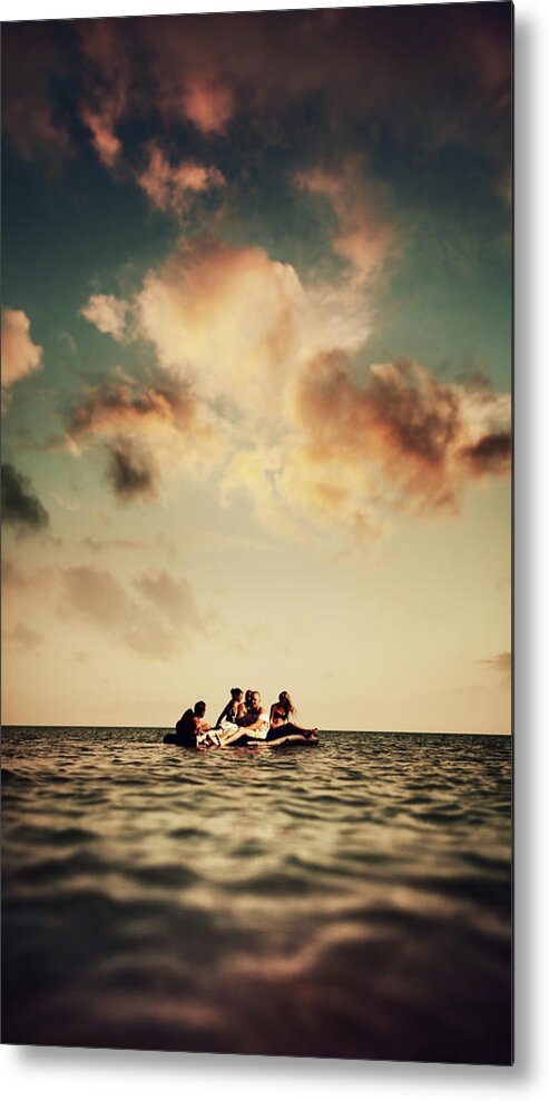 Young Men Metal Print featuring the photograph Young People Enjoying Beach Party by Piskunov