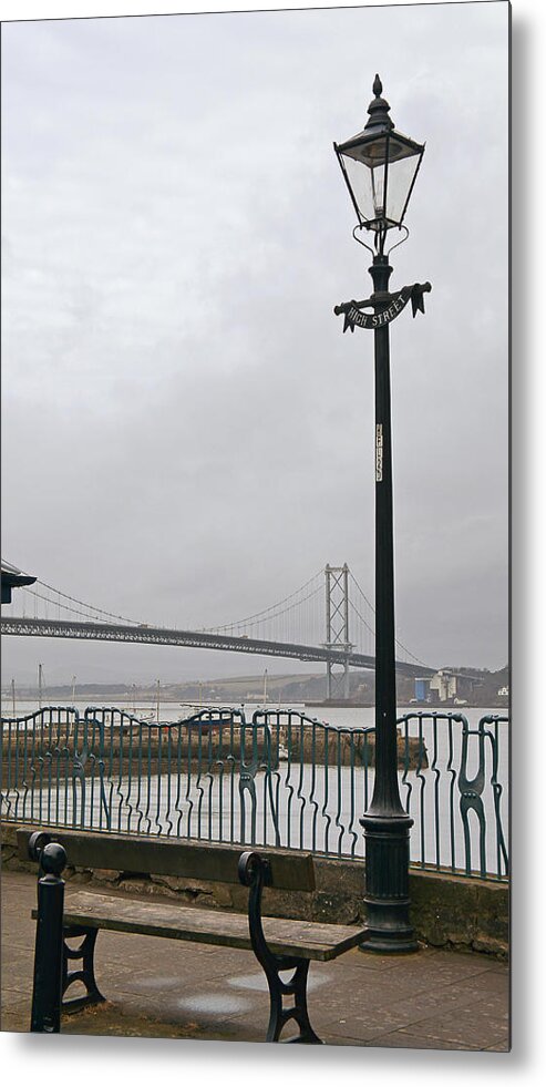 Bridge Metal Print featuring the photograph Lamppost on High Street with view to the Forth road bridge. by Elena Perelman