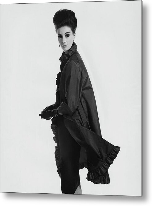 Fashion Metal Print featuring the photograph Model Wearing Ruffled Raincoat by Karen Radkai