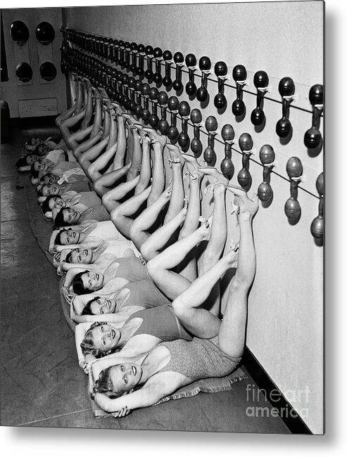The Weight Metal Print featuring the photograph Chorus Girls Doing Leg Exercises At Gym by Bettmann