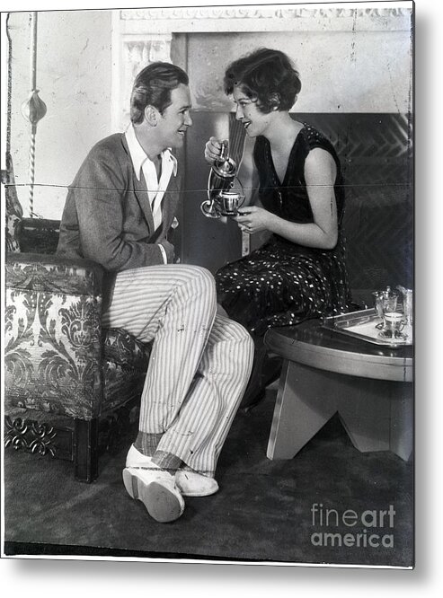 Douglas Fairbanks Sr. Metal Print featuring the photograph Joan Crawford Pours Cup Of Tea by Bettmann