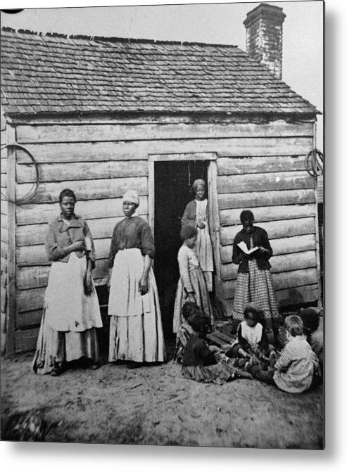 Child Metal Print featuring the photograph Presumed Slaves And Their Shack by Hulton Archive
