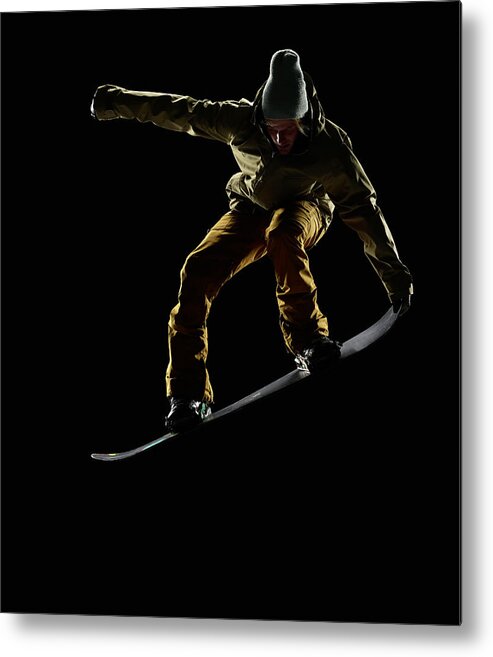 People Metal Print featuring the photograph Snowboarder Pulling Front Nose Grab Mid by Lewis Mulatero