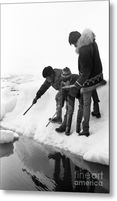 Ice Fishing Metal Print featuring the photograph Inuit boys Ice fishing Barrow Alaska July 1969 #2 by Monterey County Historical Society