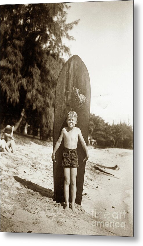 Little Boy Metal Print featuring the photograph Little boy with Wooden Surfboard Circa 1960 by Monterey County Historical Society