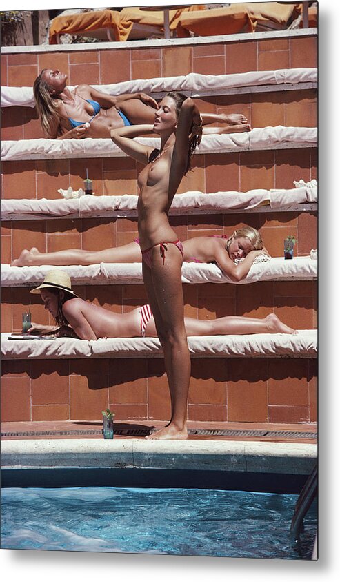 1980-1989 Metal Print featuring the photograph Sunbathing On Capri by Slim Aarons