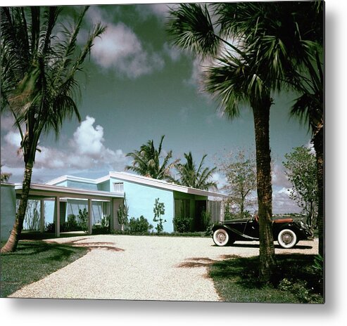 Nobodyoutdoorsdaytimehousedwellingdrivewayretroold-fashionedvintagevintage Cartransportationcarmotor Vehicleautomobilevehicletreemiamimiami-dade Countyfloridausanorth Americasouthern United Statesnorth American Atlantic Coastrobert M. Littlearchitecture #condenasthouse&gardenphotograph November 1st 1955 Metal Print featuring the photograph A Vintage Car Parked Outside A Blue House by Tom Leonard