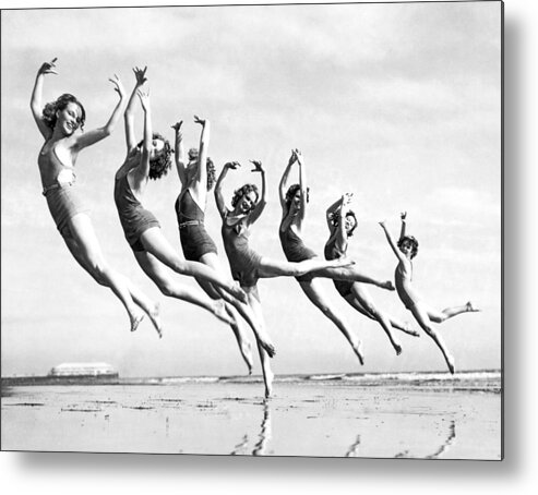 1930's Metal Print featuring the photograph Graceful Line Of Beach Dancers by Underwood Archives