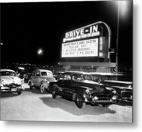 1950-1959 Metal Print featuring the photograph Cars At A Drive-in Theater by Bettmann