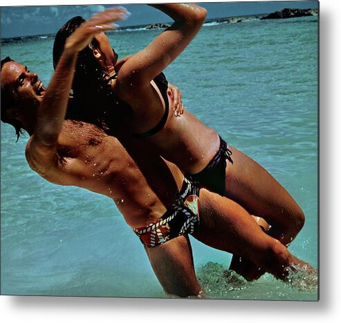 #new2022 Metal Print featuring the photograph Couple Playing In The Sea by Jacques Malignon