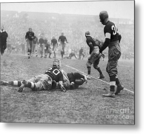 People Metal Print featuring the photograph Jim Thorpe Tackling Player by Bettmann