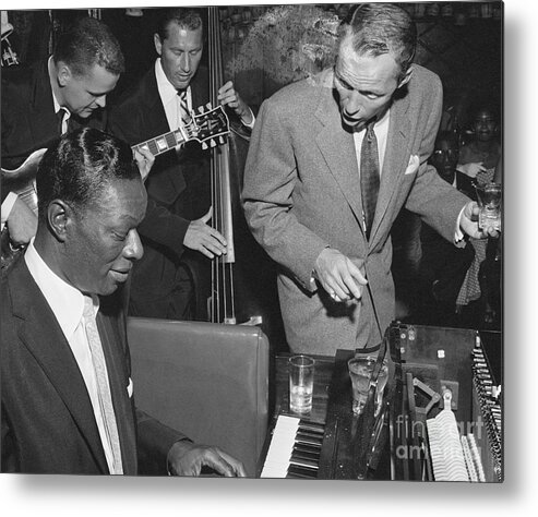 Singer Metal Print featuring the photograph Nat King Cole Playing With Frank Sinatra by Bettmann