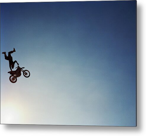 Crash Helmet Metal Print featuring the photograph Silhouette Of Man Performing Stunts On by Andy Ryan