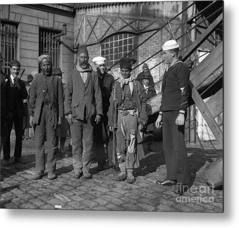 People Metal Print featuring the photograph Some Ragged Looking Refugees Wsailor by Bettmann