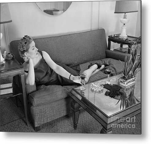 Smoking Metal Print featuring the photograph Woman Lounging On Sofa by Bettmann