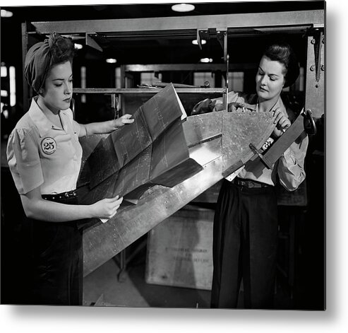 Three Quarter Length Metal Print featuring the photograph Women Working In Factory by George Marks