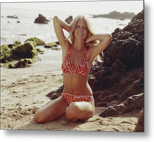 Three Quarter Length Metal Print featuring the photograph Young Woman In Bikini Sitting On Beach by Tom Kelley Archive