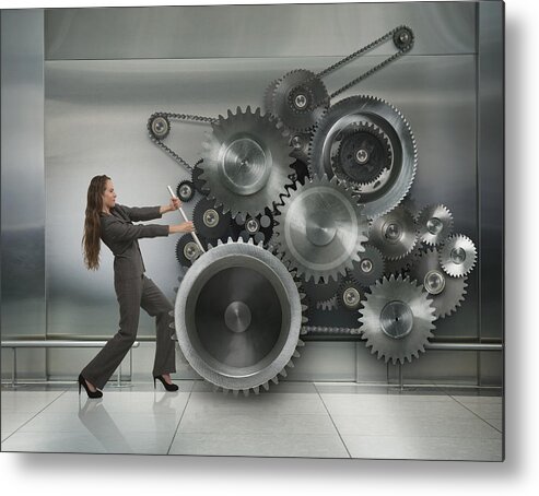 Working Metal Print featuring the photograph Caucasian businesswoman working metal cogs by John M Lund Photography Inc