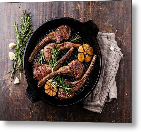 Black Color Metal Print featuring the photograph Roasted lamb ribs with rosemary and garlic by Lisovskaya