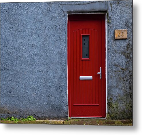 Red Door Metal Print featuring the photograph Traditional English house facade front entrance with red closed door . by Michalakis Ppalis