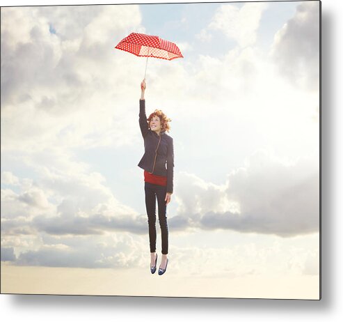 Frome Metal Print featuring the photograph Young woman flying with umbrella. by Tim Robberts