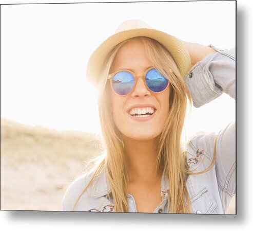 People Metal Print featuring the photograph Caucasian woman wearing hat and sunglasses on beach by Jacobs Stock Photography Ltd