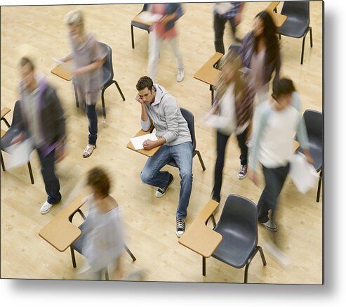 Young Men Metal Print featuring the photograph College students moving around man at desk in classroom by Chris Ryan
