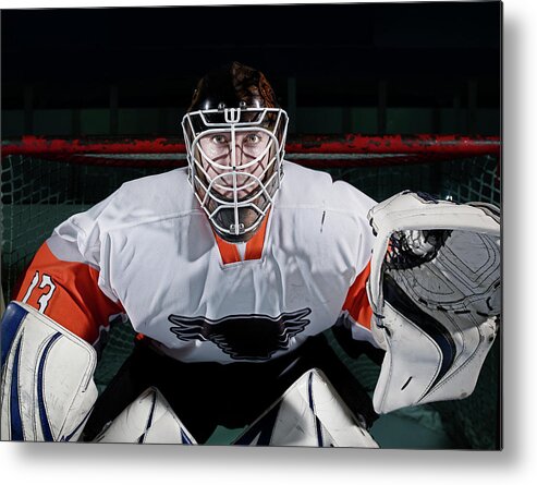 Sports Helmet Metal Print featuring the photograph Portrait Of Ice Hockey Goaltender by Mike Harrington