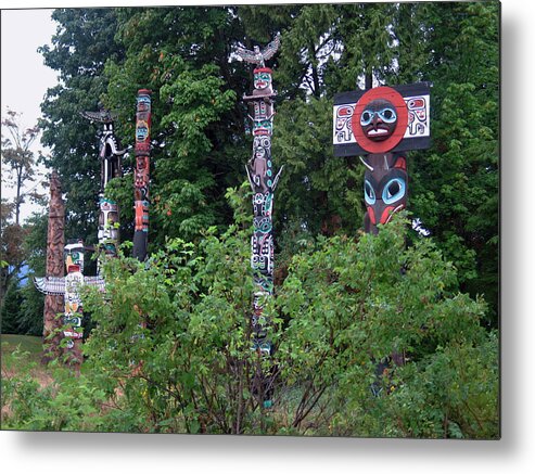 Totems Metal Print featuring the photograph Totem Poles in Stanley Park by Gerry Bates