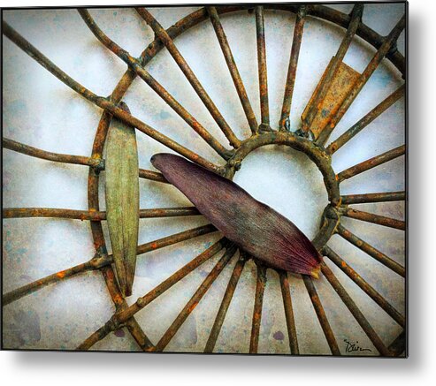 Wheel Metal Print featuring the photograph Wheel and Leaves by Peggy Dietz