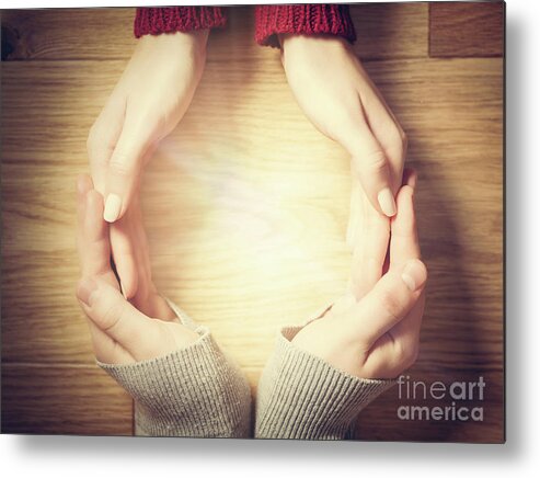 Hands Metal Print featuring the photograph Woman and man making circle with hands. Warm light inside by Michal Bednarek