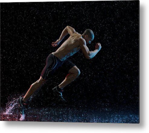 People Metal Print featuring the photograph Athlete Runner Running Through Rain by Jonathan Knowles