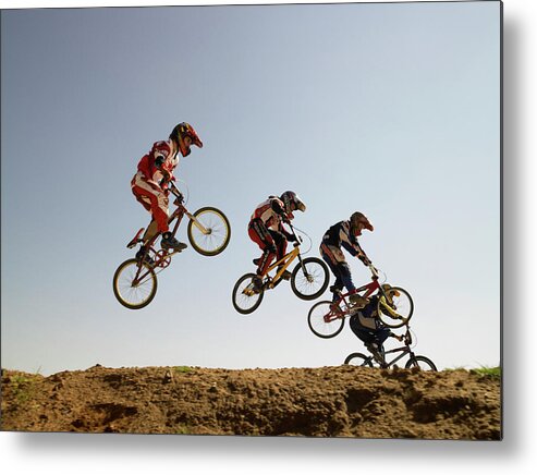 Child Metal Print featuring the photograph Bmx Cyclists In Competition by Sean Justice