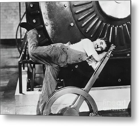 Working Metal Print featuring the photograph Charlie Chaplin In Modern Times by Bettmann