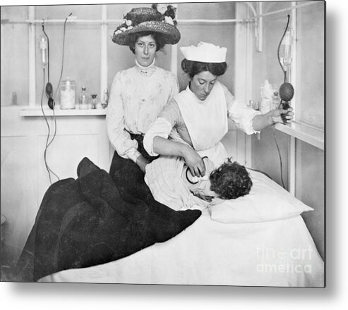Child Metal Print featuring the photograph Nurse Aiding Youth by Bettmann