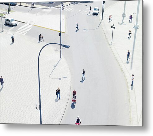 Pedestrian Metal Print featuring the photograph People Commuting In The City From by Michael Blann