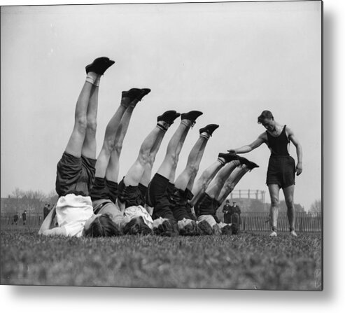 1930-1939 Metal Print featuring the photograph Up We Go by Fox Photos