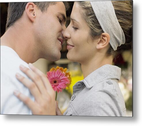 Young Men Metal Print featuring the photograph Couple about to kiss #2 by Image Source