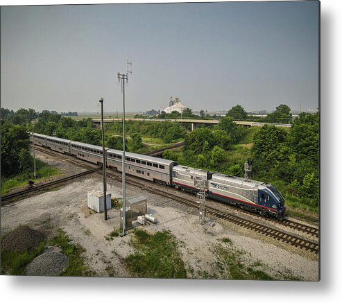 Railroad Metal Print featuring the photograph AMTRAK 390 heads north across the diamond at Tuscola IL by Jim Pearson
