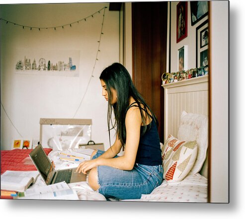 Asian And Indian Ethnicities Metal Print featuring the photograph Profile Shot Of Teenage Girl In Her Bedroom, Working On Laptop by Alys Tomlinson