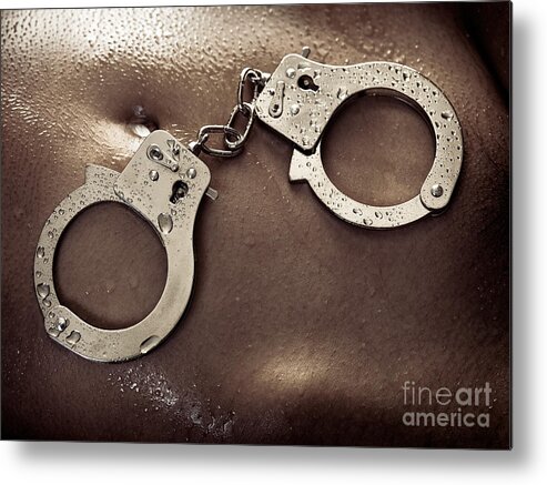 Handcuffs Metal Print featuring the photograph Shiny handcuffs on wet naked woman body by Maxim Images Exquisite Prints