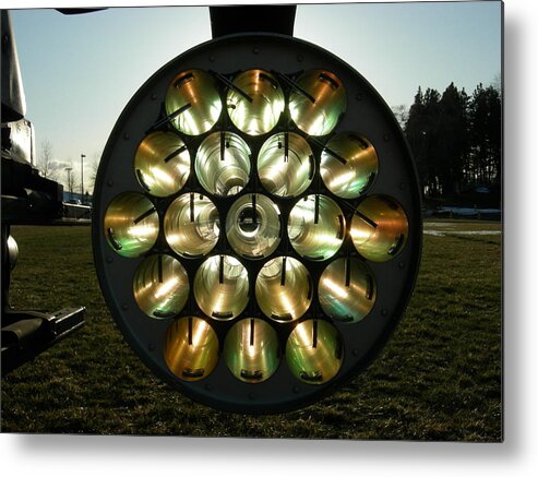 Helicopter Metal Print featuring the photograph Sun through rocket launcher by Jean Evans