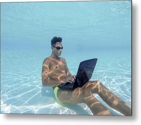 Young Men Metal Print featuring the photograph Young man using computer underwater by PJPhoto69
