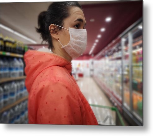 People Metal Print featuring the photograph Young woman wears medical mask against virus while grocery shopping in supermarket, by Oonal